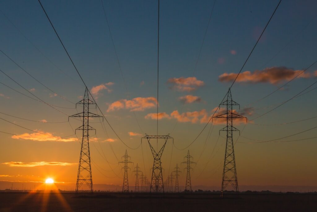 Solar panels under a bright sky