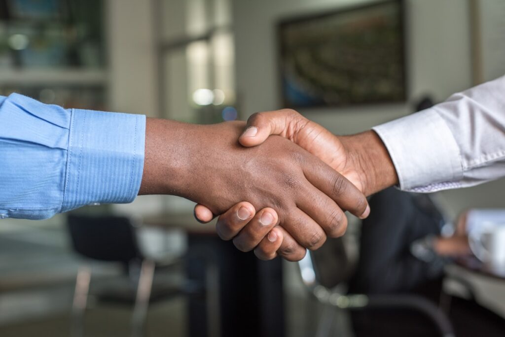 Two professionals shaking hands