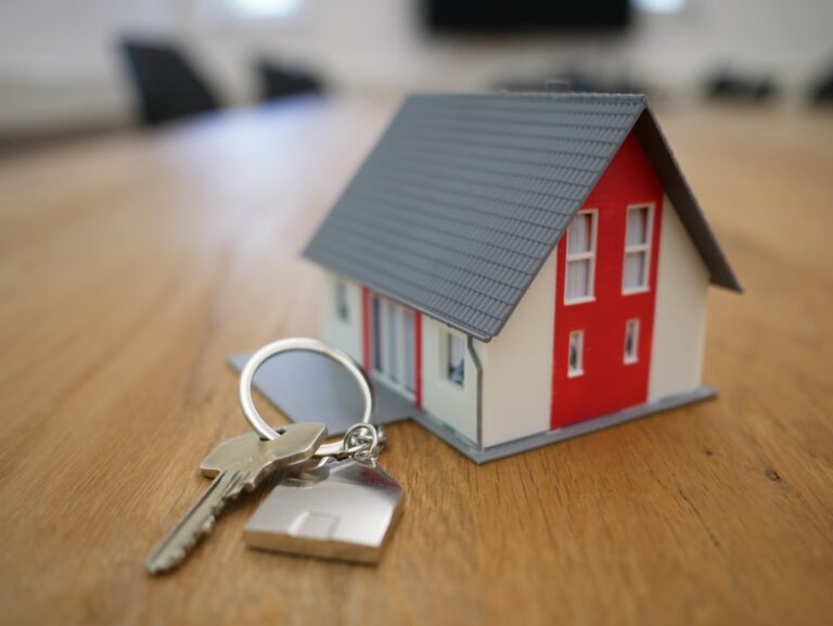 House keys handed over above a contract